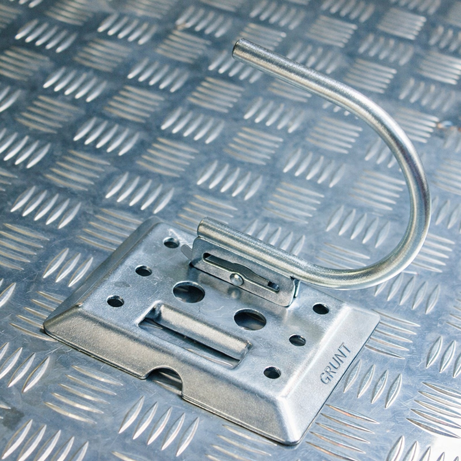 GRUNT 165mm E Track Fitting with J Hook – compatible E-Track anchor fitting with J hook for securing nets, straps, and cargo covers in trailers and vans. Easy snap-in installation. Available at Bunnings AU.
