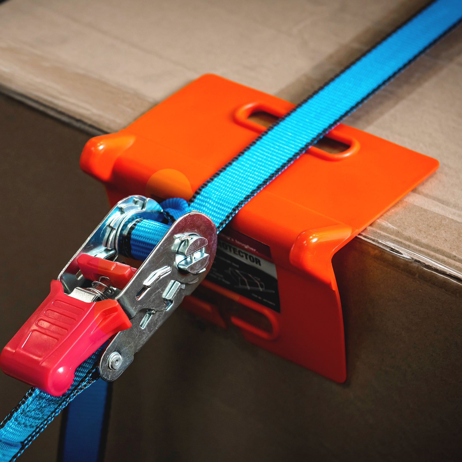 GRUNT 200mm Orange Open Edge Corner Tie Down Protector – heavy-duty corner protector for straps and tie-downs. Prevents cutting, fraying, and damage to straps over sharp edges during cargo transport. Available at Bunnings AU and NZ.
