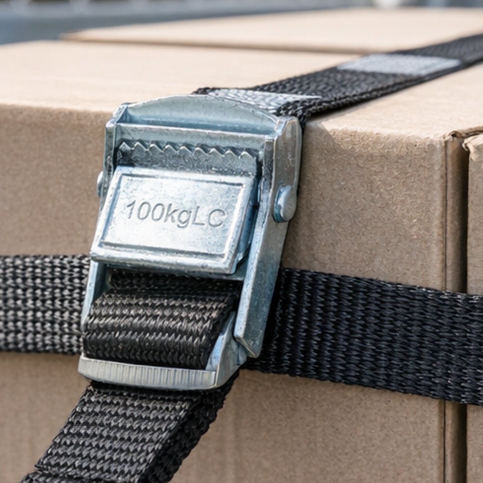 GRUNT 25mm x 1m Black Pull Tie Down Strap 2-Pack – compact cam-buckle pull straps for securing light loads, bikes, and camping gear. Simple pull-to-tighten mechanism for fast load securing. Available at Bunnings AU and NZ.