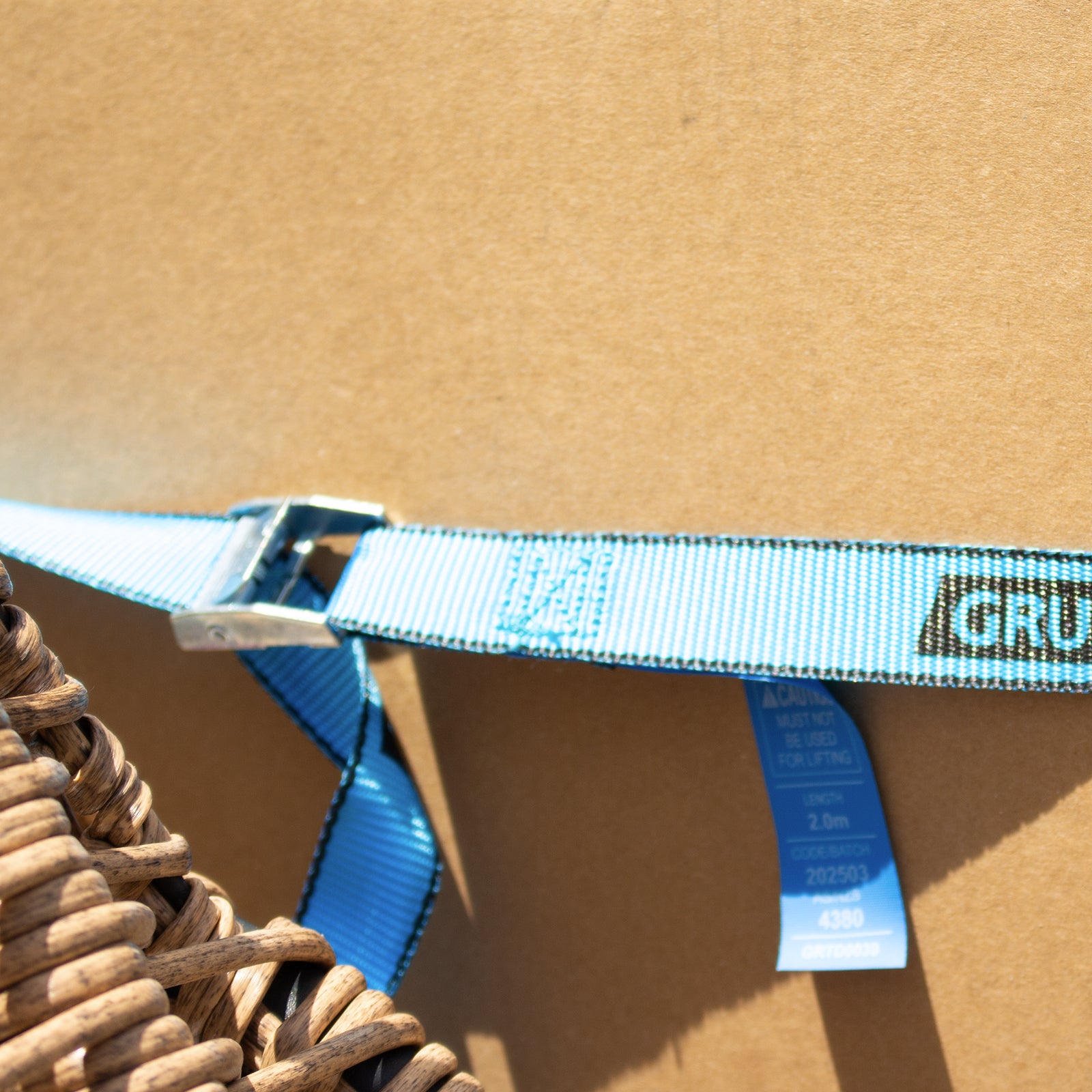 GRUNT 25mm x 2m Blue Pull Tie Down Strap – cam-buckle pull strap for securing light loads, motorcycles, and sports equipment. Quick and easy pull-to-lock mechanism. Available at Bunnings AU and NZ.
