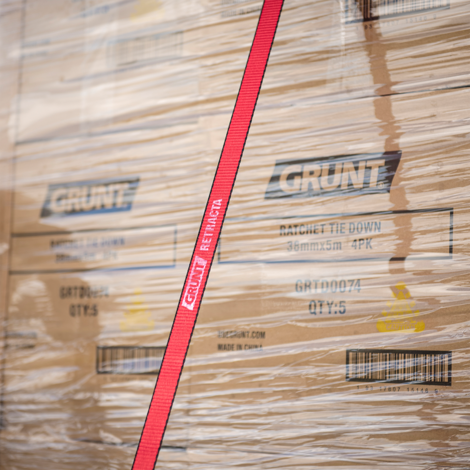 GRUNT 25mm x 3.5m Black Retractable Ratchet Tie Down 2-Pack – self-retracting ratchet straps for tangle-free load securing on trailers and utes. Auto-rewind for easy storage and deployment. Available at Bunnings AU and NZ.