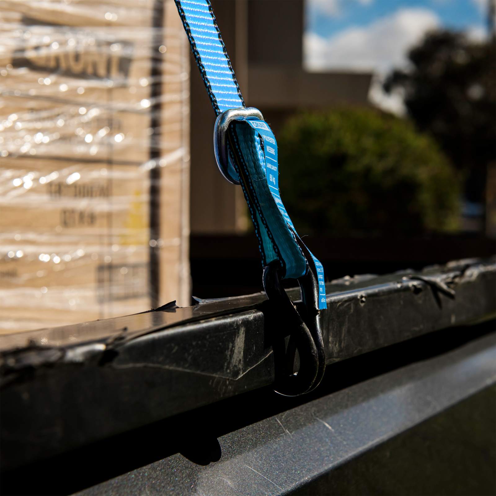 GRUNT 25mm x 4m Blue and Black Ratchet Tie Down Straps 2-Pack – compact ratchet straps for securing light-to-medium loads on trailers, utes, and roof racks. Easy-to-use ratchet mechanism. Available at Bunnings AU.