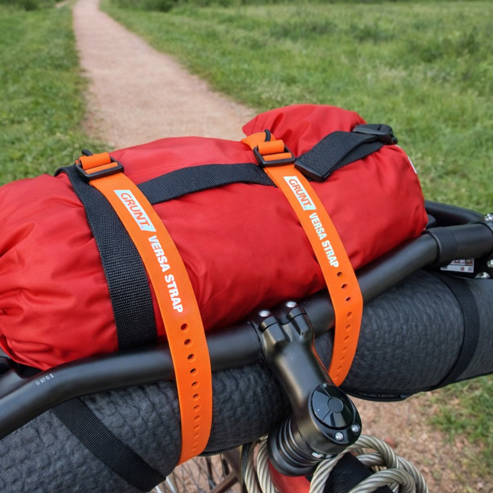 GRUNT 25mm x 80cm Orange Versa Extra Wide Strap – versatile wide-body securing strap for bundling tools, cables, and gear. Hook-and-loop fastening for quick and easy load management. Available at Bunnings AU and NZ.
