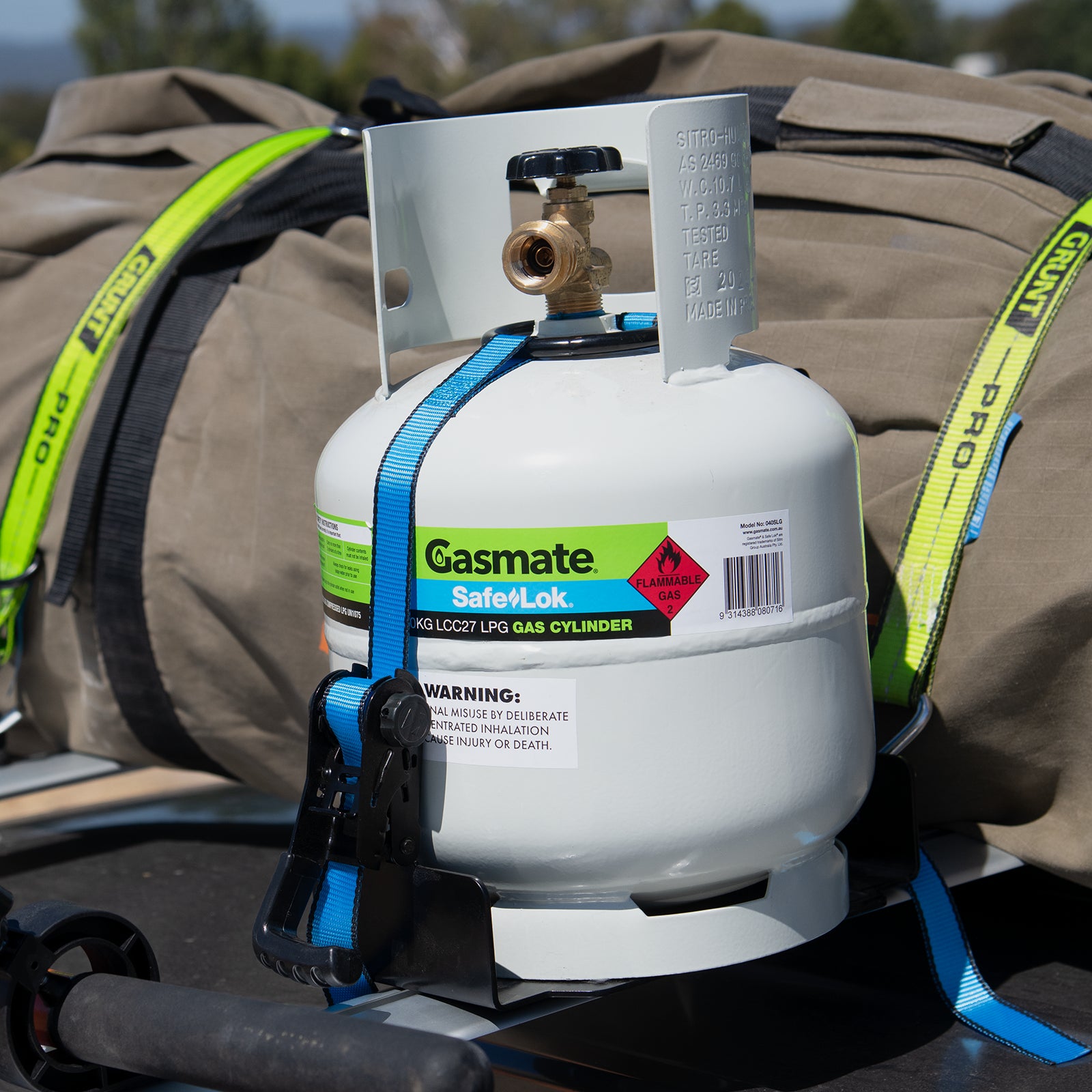 GRUNT 405mm Blue Universal T Slot Gas Bottle Holder – T-track compatible holder for safely securing BBQ gas bottles and cylinders on ute trays and work vehicles during transport. Available at Bunnings AU and NZ.