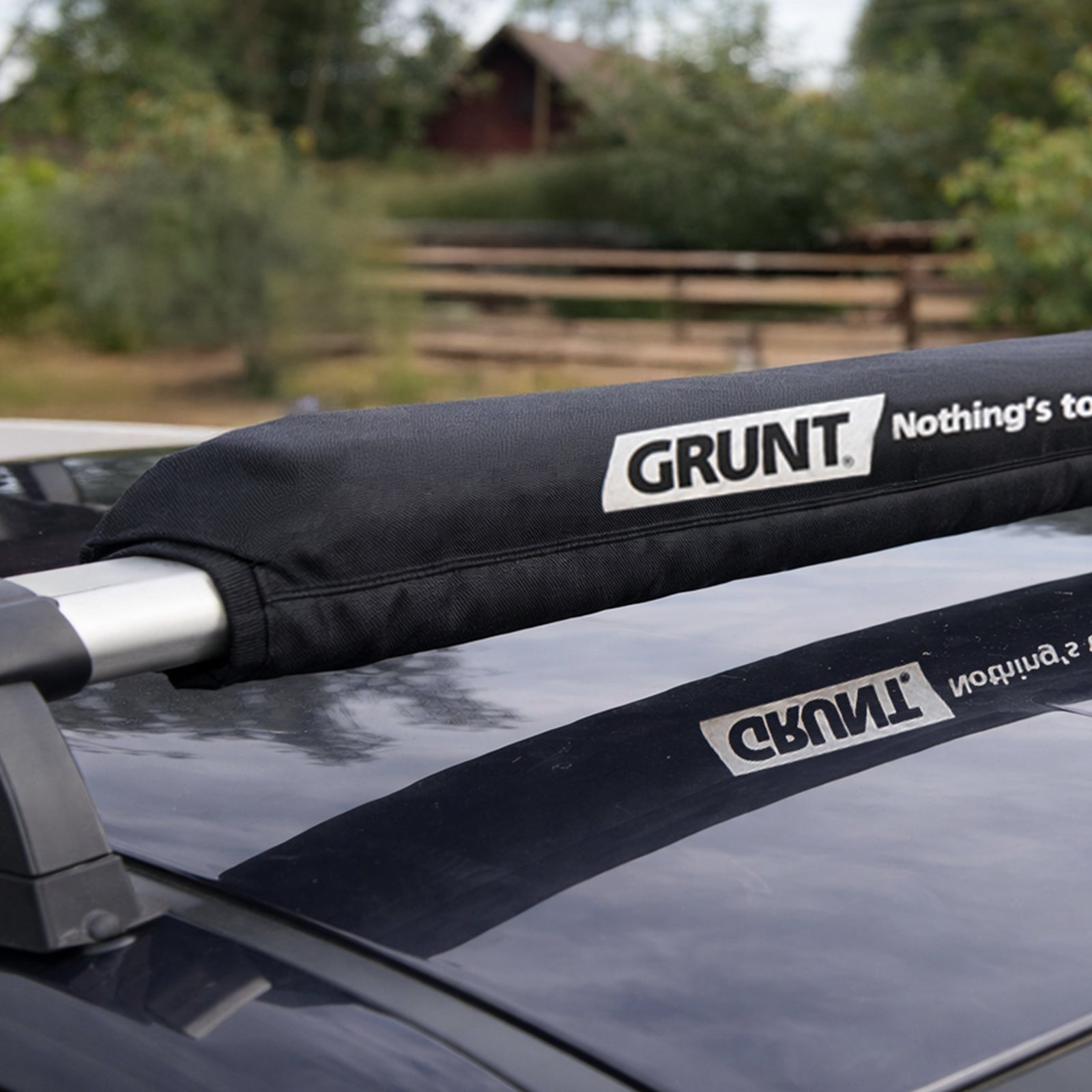 GRUNT 500mm Black Cargo Protector – padded edge protector for tie-down straps over sharp cargo corners. Prevents strap damage and protects cargo surfaces during transport. Available at Bunnings AU and NZ.