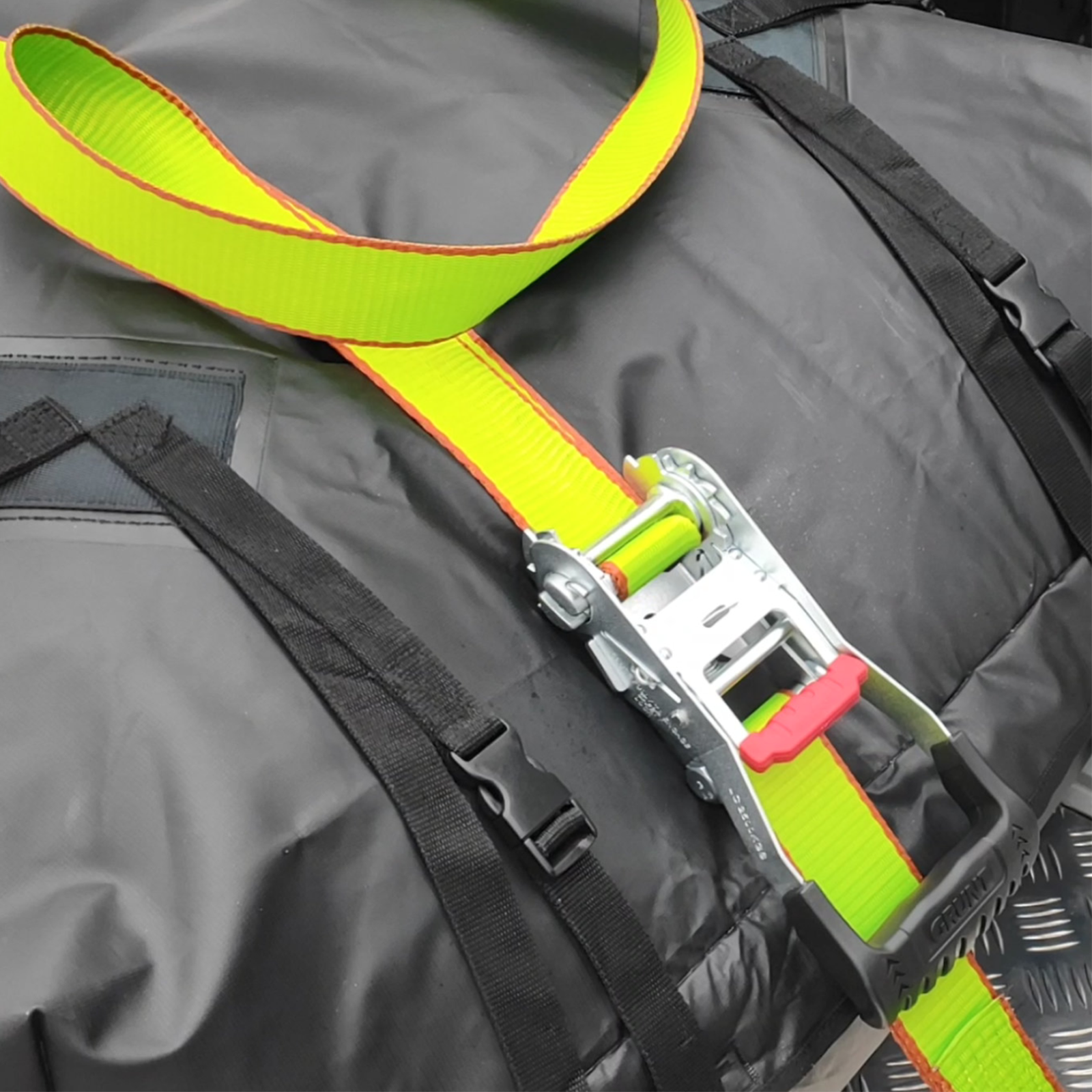 GRUNT Ezi-Load 50mm x 9m Green Heavy Duty Ratchet Tie Down – extra-wide long-reach ratchet strap with Ezi-Load single-hand system for securing heavy cargo and machinery. Available at Bunnings AU and NZ.