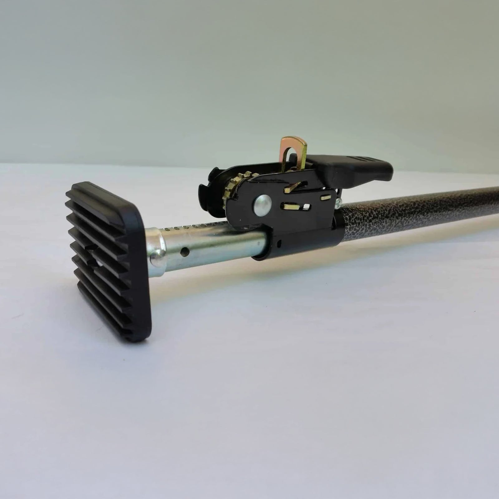 GRUNT 115mm Ratcheting Cargo Bar – adjustable spring-loaded cargo bar for securing loads in vans, utes, and trailers. Prevents load shifting without straps. Tool-free installation. Available at Bunnings AU and NZ.