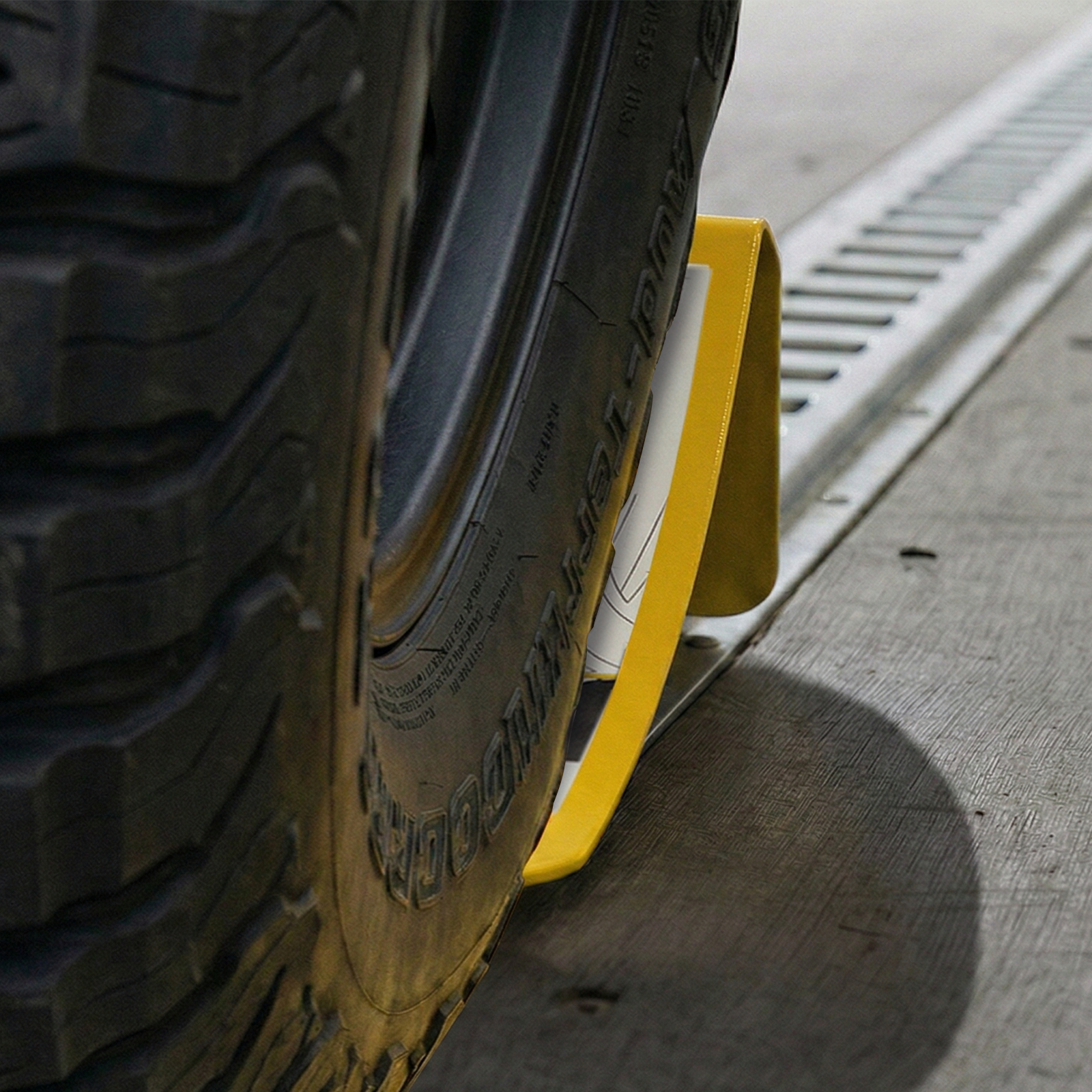 GRUNT 167mm E Track Wheel Chock – E-Track compatible wheel chock for securing motorcycles and wheeled equipment during transport. Prevents forward/backward movement on trailer beds. Available at Bunnings AU and NZ.