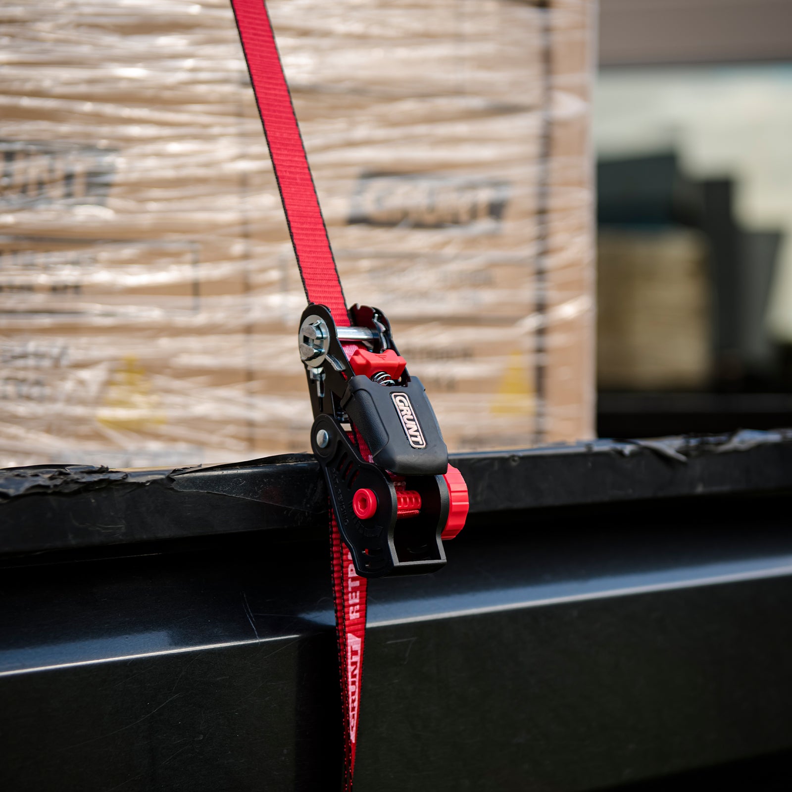 GRUNT 35mm x 5m Red Safety Auto Retractable Tie Down – self-retracting ratchet strap for tangle-free, single-hand load securing on trailers and utes. Auto-rewind for fast deployment and neat storage. Available at Bunnings AU and NZ.