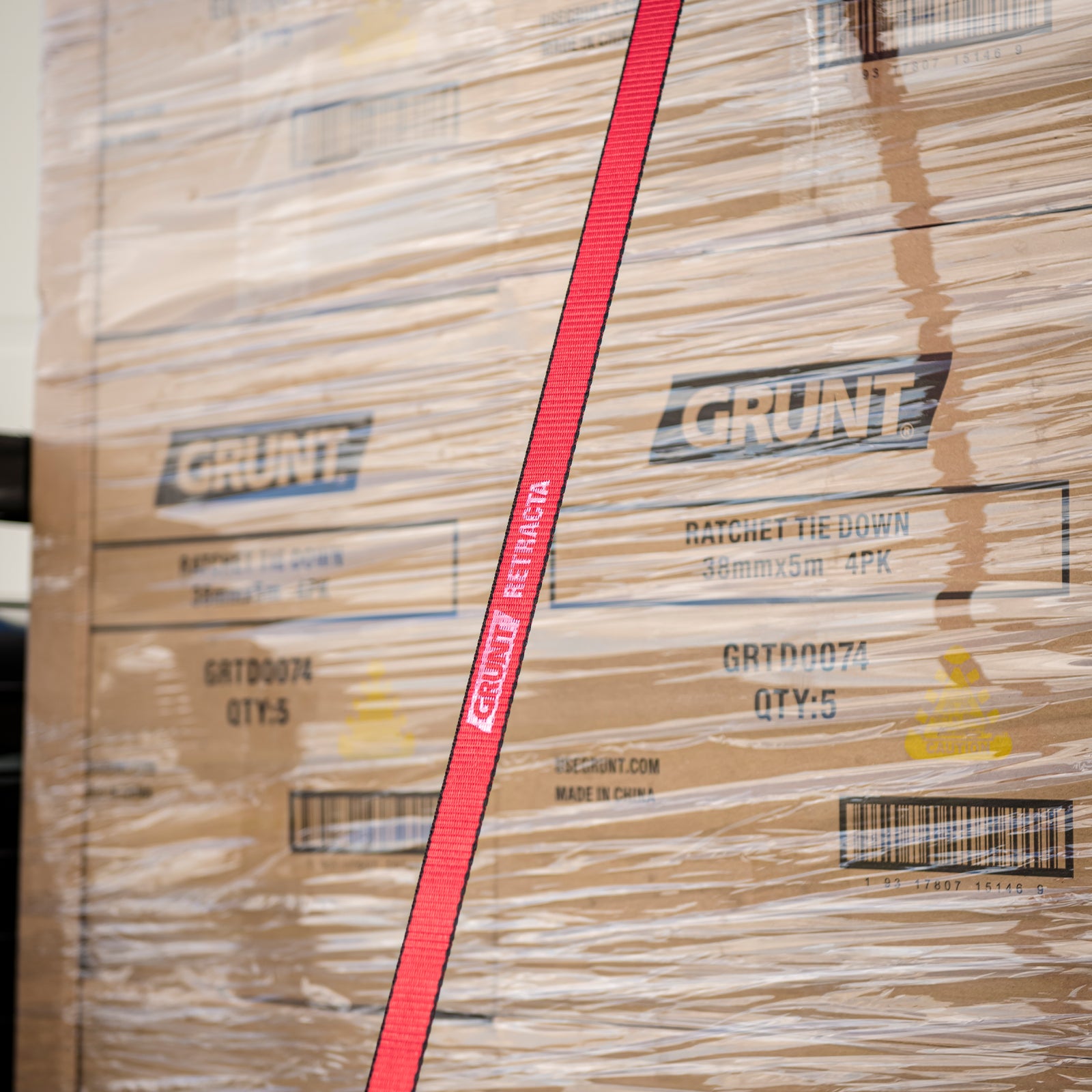 GRUNT 35mm x 5m Red Safety Auto Retractable Tie Down – self-retracting ratchet strap for tangle-free, single-hand load securing on trailers and utes. Auto-rewind for fast deployment and neat storage. Available at Bunnings AU and NZ.
