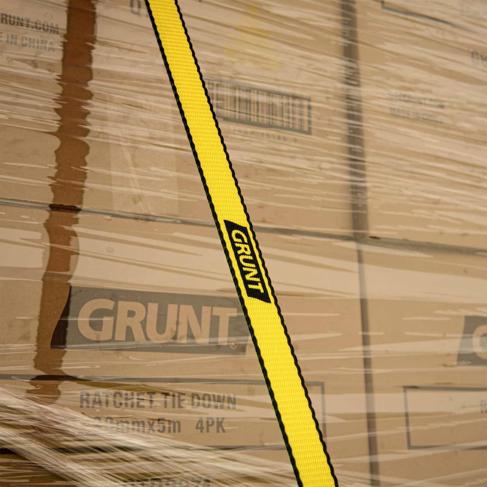 GRUNT 50mm x 6m Yellow Heavy Duty Ratchet Tie Down – extra-wide high-strength ratchet strap for securing heavy machinery and large loads. High working load for professional and tradie transport. Available at Bunnings AU and NZ.