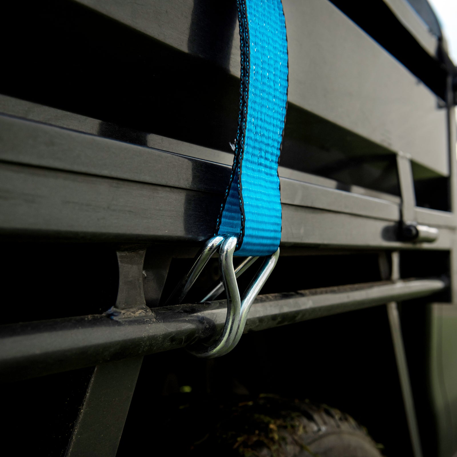 GRUNT 75mm x 10m Blue and Yellow Extreme Heavy Duty Ratchet Tie Down – maximum-strength extra-wide ratchet strap for securing excavators, machinery, and heavy plant. Top-of-range load restraint. Available at Bunnings AU and NZ.